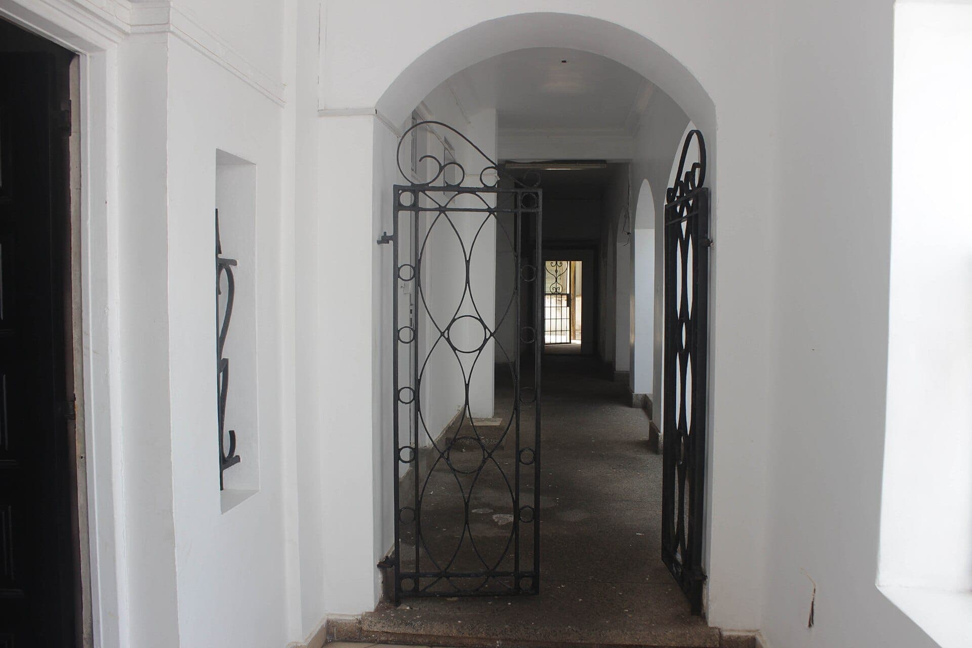 A gated passage inside Osu Castle.