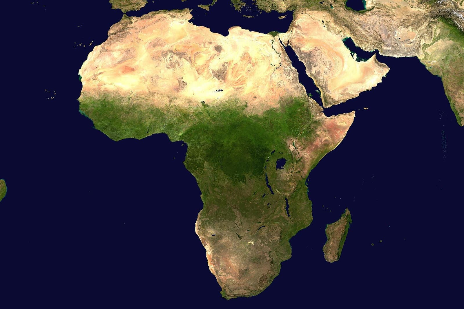 Africa seen from space, the whole continent visible against dark ocean.